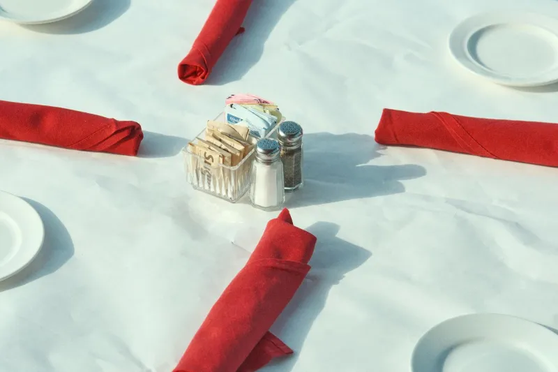 The Tiny Paper Packet That Turned Salt Into a Restaurant Staple — And Why Fine Dining Still Refuses to Put It on the Table